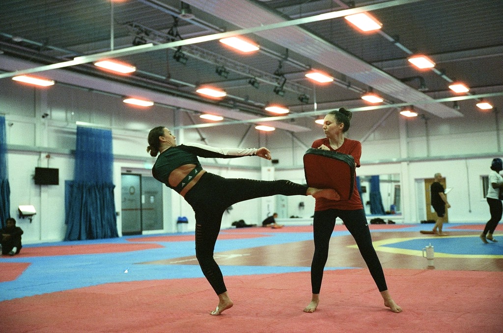 Amy Truesdale kicking a training pad during a kick training session