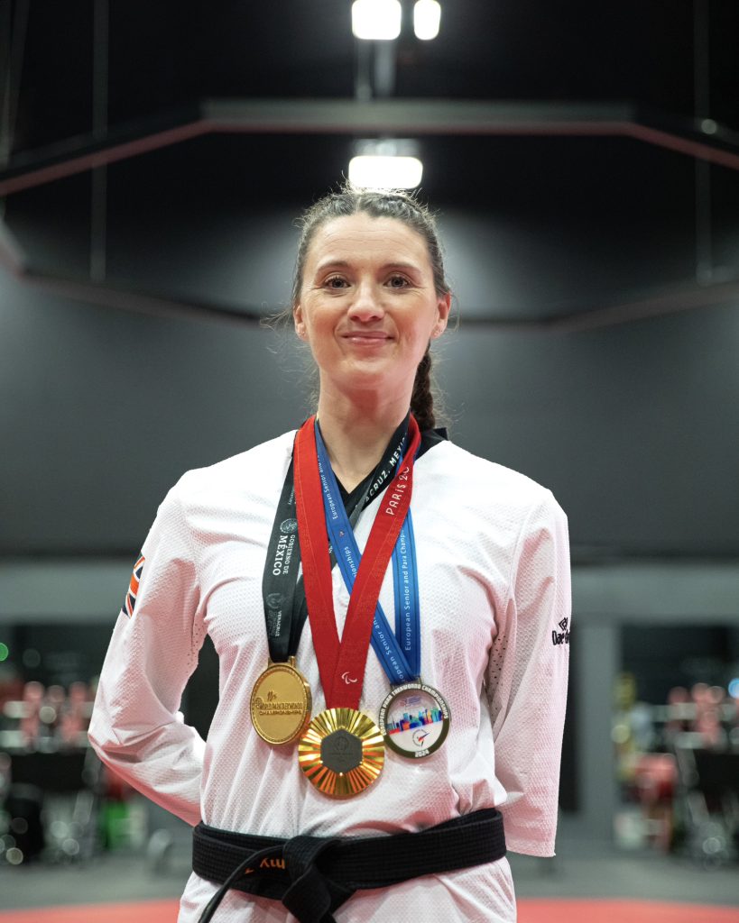 Amy Truesdale proudly wearing her medals